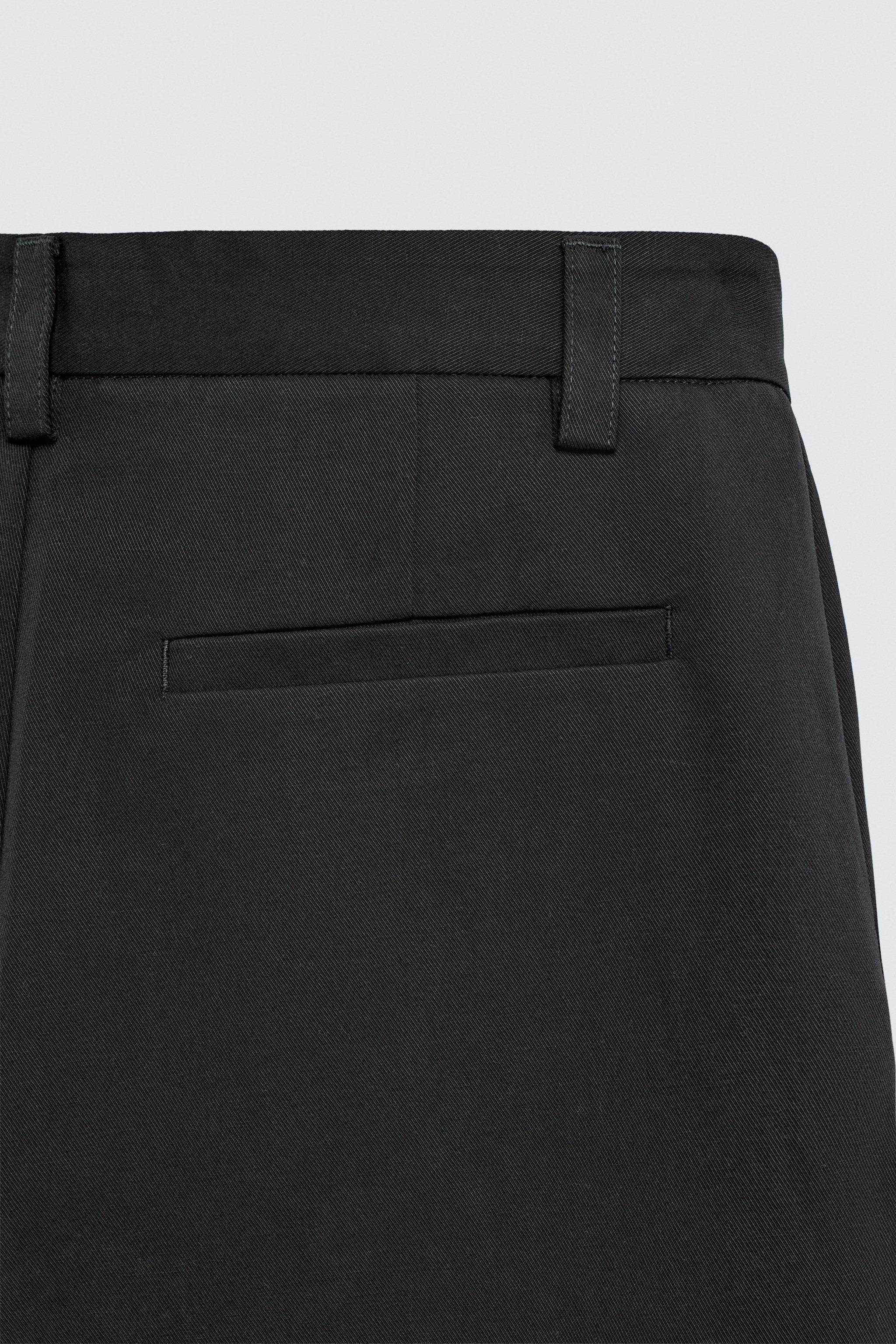PANTALON COUPE LARGE À PLIS